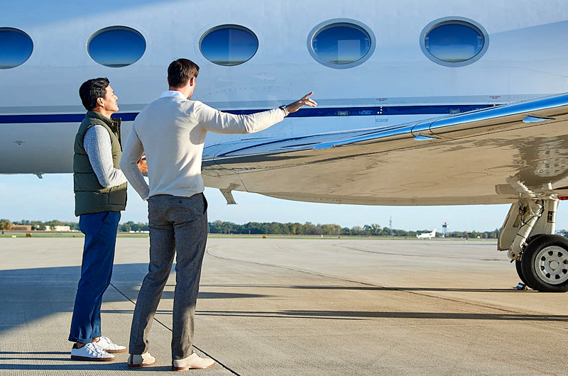 jet owner with priester aviation representative at their jet